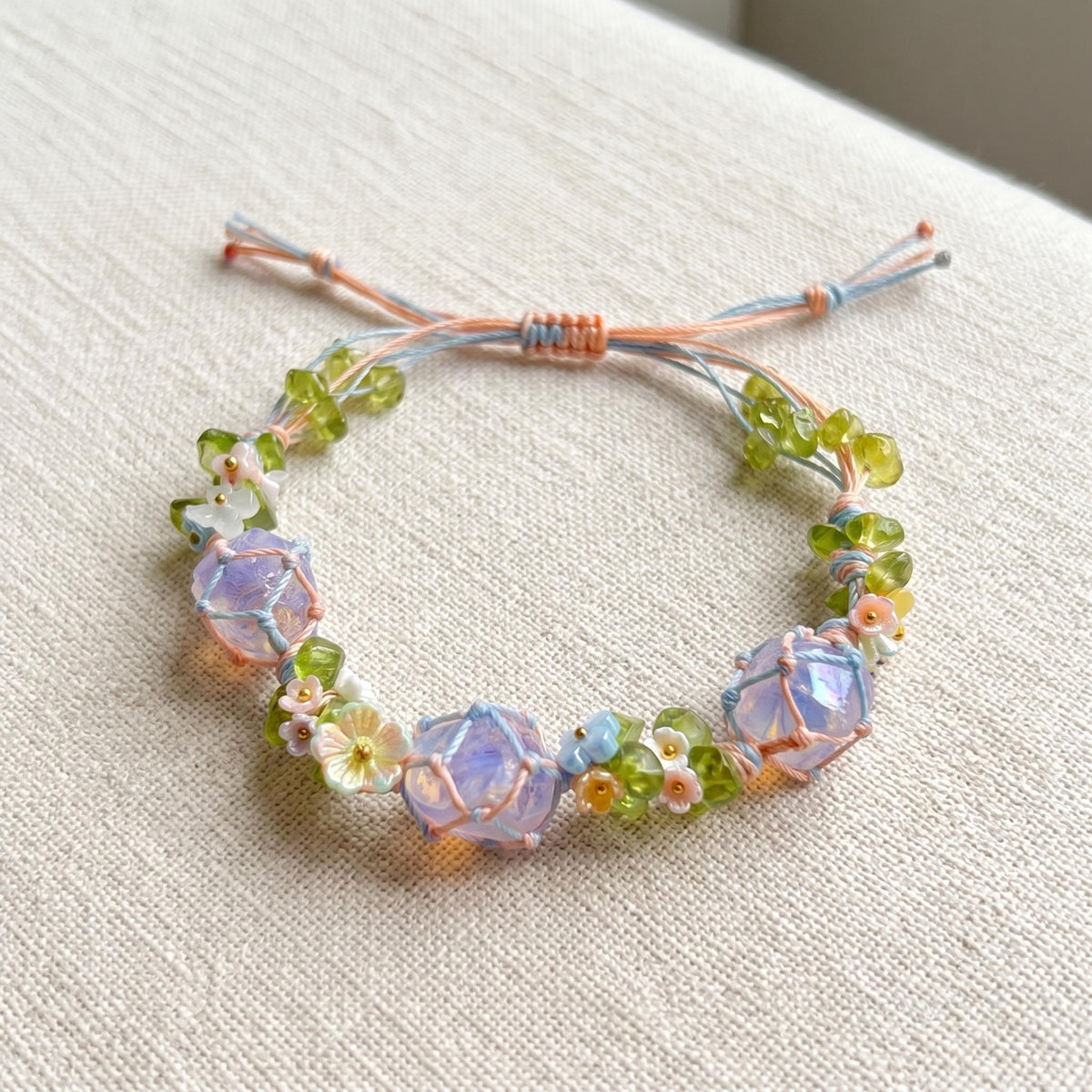 Woven Rope Bracelet with Raw Crystals and Pastel Flowers – Botanical Fairycore Jewelry