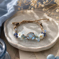 Blue Crystal Flower Bracelet: Adjustable Woven Cord Jewelry