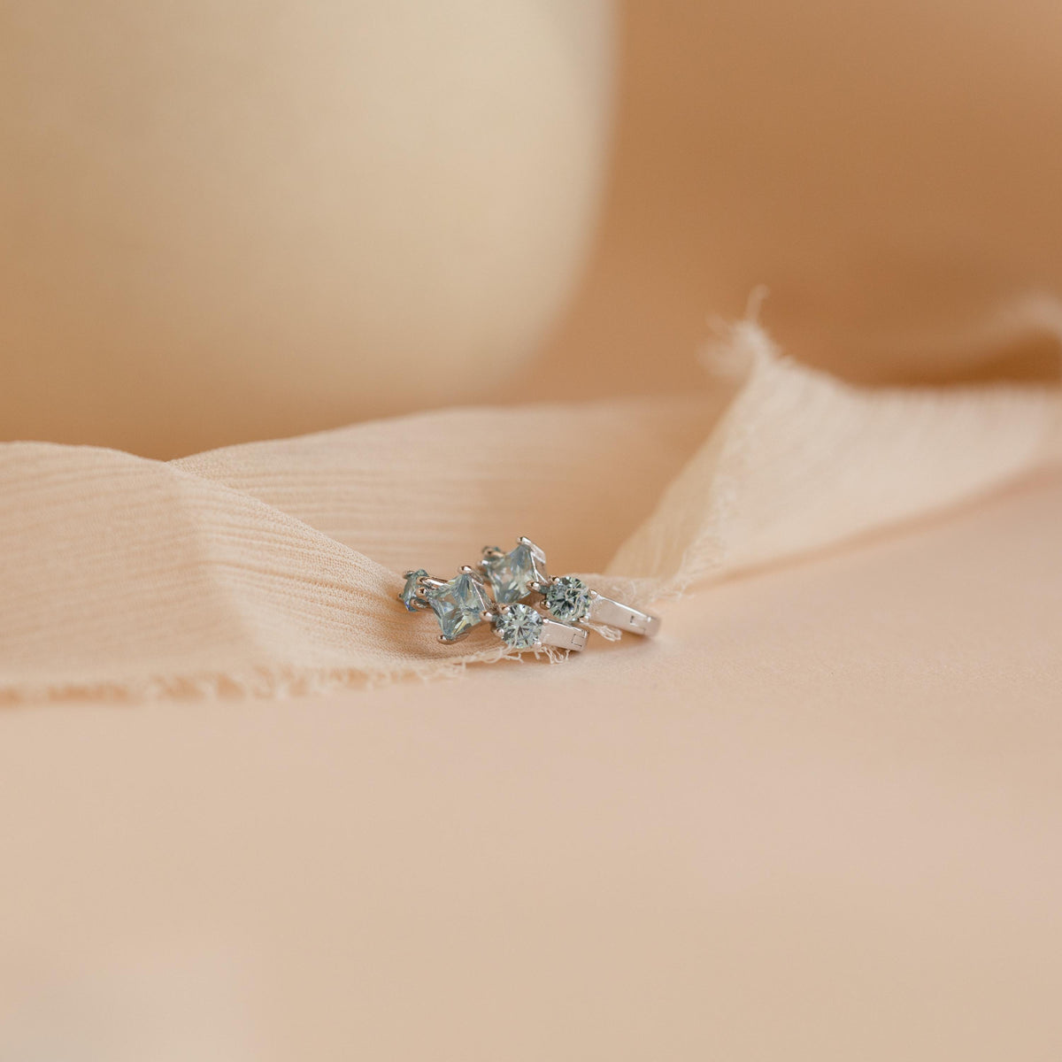 Aquamarine Huggie Hoops by Seven Lucky Gifts • Dainty Blue Crystal Gemstone Earrings • Silver Birthstone Jewelry • Bridesmaid Gift
