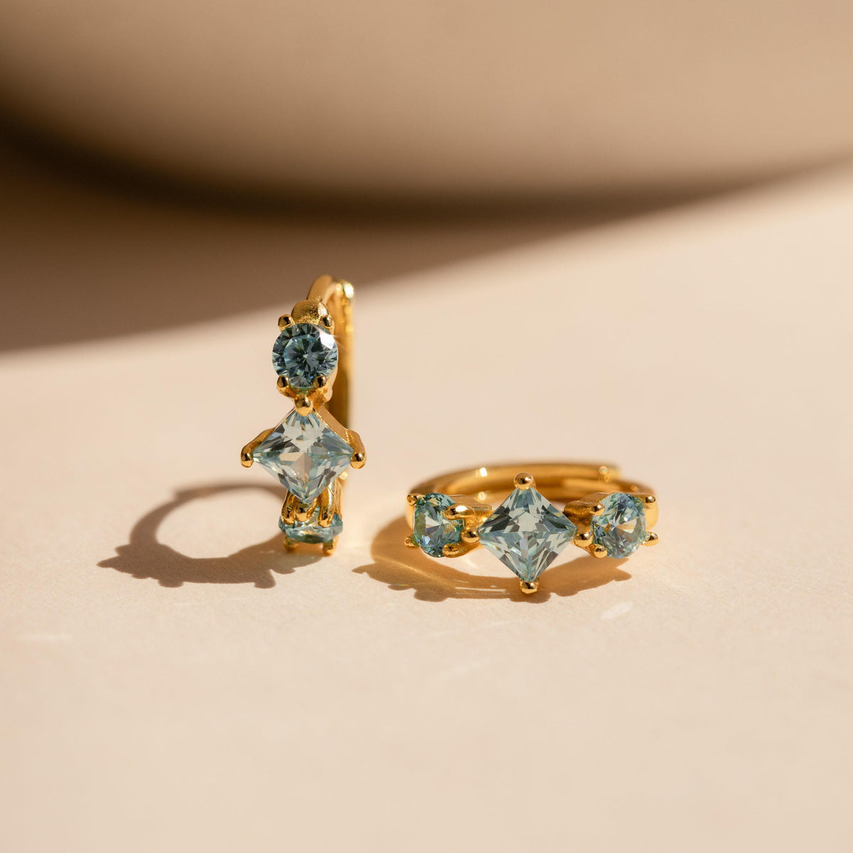 Aquamarine Huggie Hoops by Seven Lucky Gifts • Dainty Blue Crystal Gemstone Earrings • Silver Birthstone Jewelry • Bridesmaid Gift